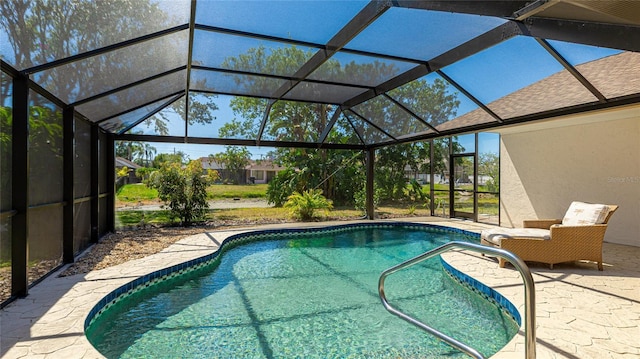 outdoor pool with a patio and a lanai