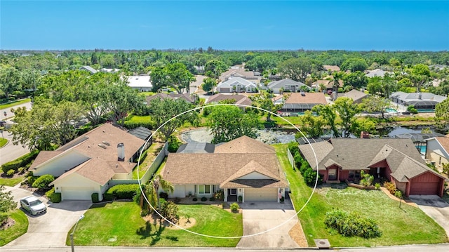 birds eye view of property with a residential view