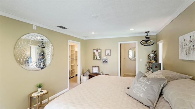 bedroom with recessed lighting, baseboards, a spacious closet, visible vents, and ornamental molding
