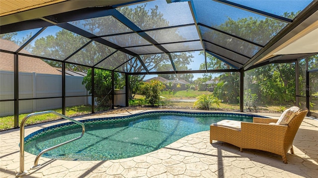 pool featuring a lanai and a patio area