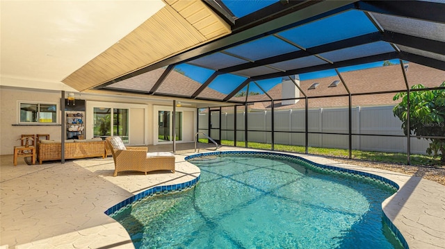 view of pool featuring fence, a patio, an outdoor living space, a fenced in pool, and glass enclosure
