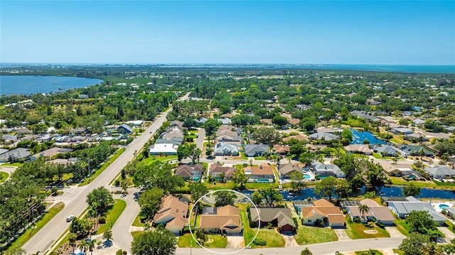 bird's eye view with a residential view and a water view