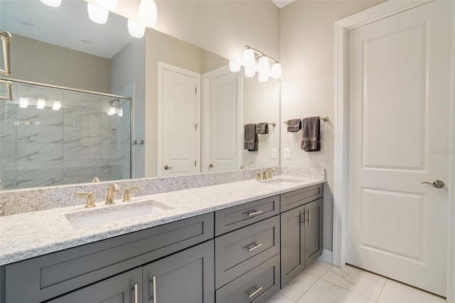 full bathroom with a marble finish shower, marble look tiles, and double vanity