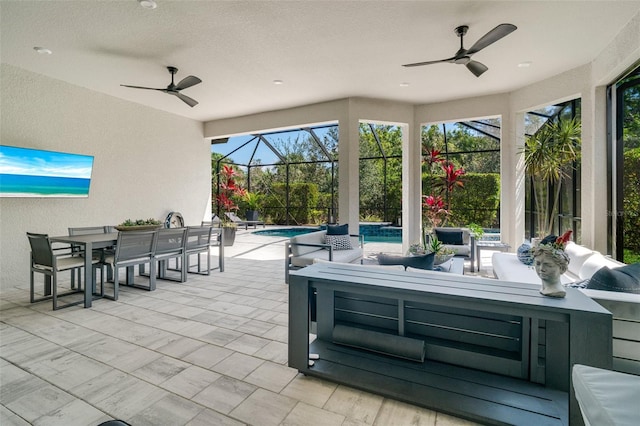 view of patio with ceiling fan, an outdoor hangout area, outdoor dining space, and an outdoor pool