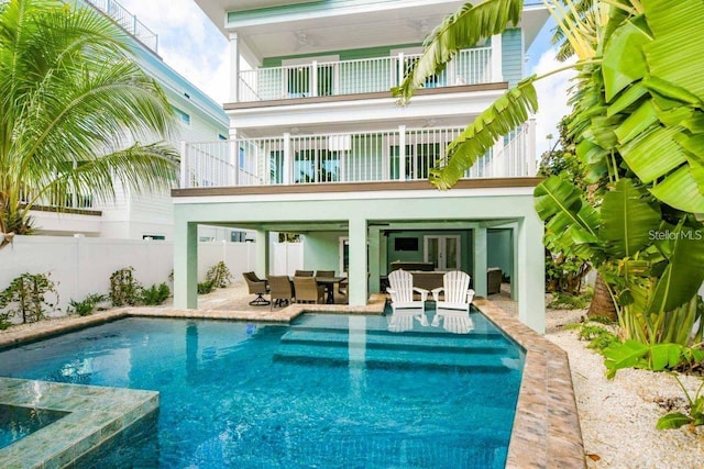 336 Avenida De Mayo, Sarasota, FL 34242 - back of property featuring fence, a patio, french doors, outdoor dining space, and a fenced in pool