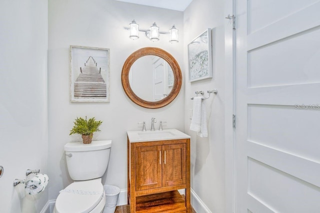 336 Avenida De Mayo, Sarasota, FL 34242 - half bathroom featuring toilet, vanity, and baseboards
