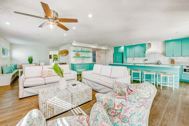 336 Avenida De Mayo, Sarasota, FL 34242 - living room with recessed lighting, a textured ceiling, light wood-style floors, and ceiling fan