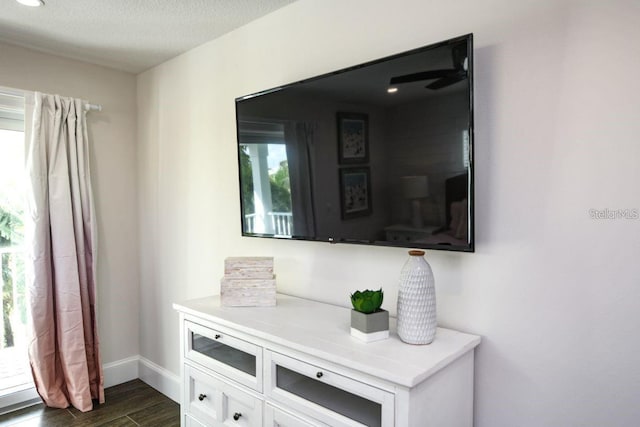 336 Avenida De Mayo, Sarasota, FL 34242 - room details with baseboards, a textured ceiling, and wood finished floors
