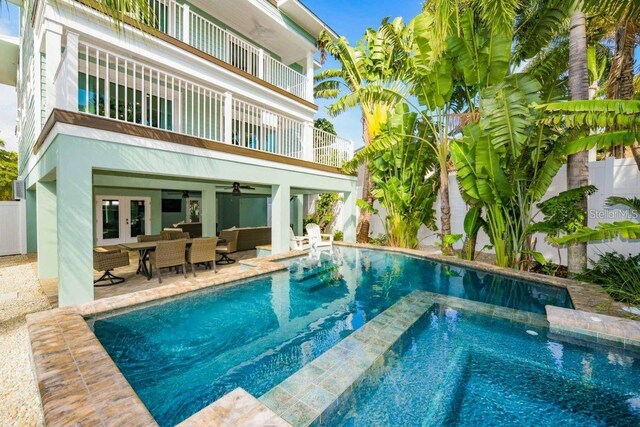 336 Avenida De Mayo, Sarasota, FL 34242 - outdoor pool with an outdoor living space, ceiling fan, french doors, and a patio area