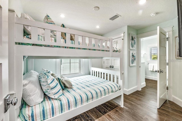 336 Avenida De Mayo, Sarasota, FL 34242 - bedroom featuring recessed lighting, baseboards, a textured ceiling, visible vents, and wood finished floors