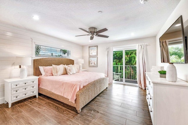 336 Avenida De Mayo, Sarasota, FL 34242 - bedroom with a textured ceiling, access to exterior, ceiling fan, and wood finished floors