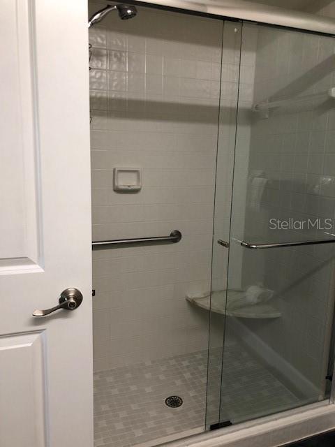 bathroom with a shower stall
