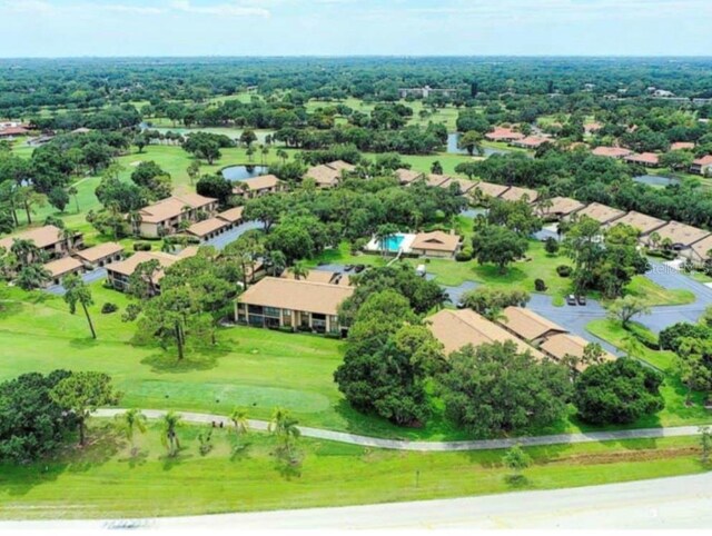 aerial view featuring view of golf course and a residential view