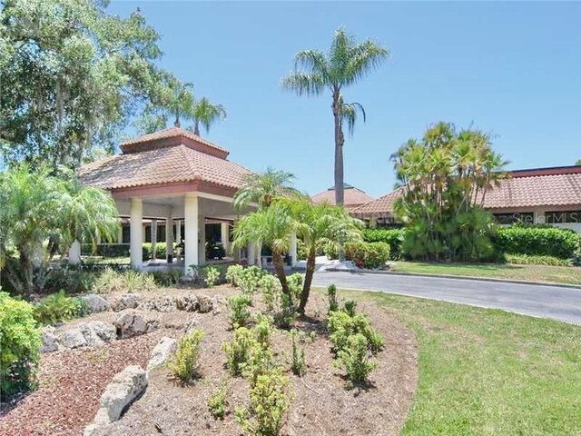 view of front of house featuring stucco siding and a tiled roof