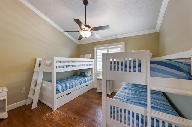 bedroom with crown molding, wood finished floors, ceiling fan, and a textured ceiling