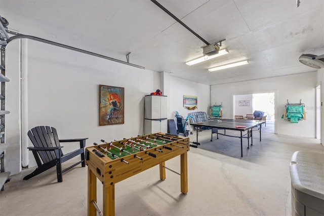 rec room with a garage and concrete flooring