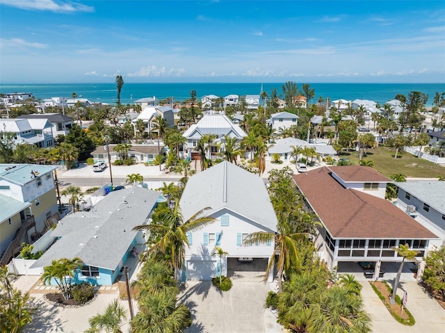 bird's eye view with a water view and a residential view
