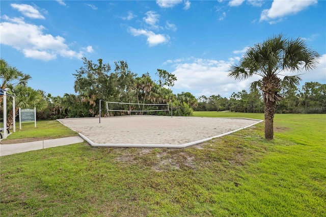 view of home's community featuring volleyball court and a lawn