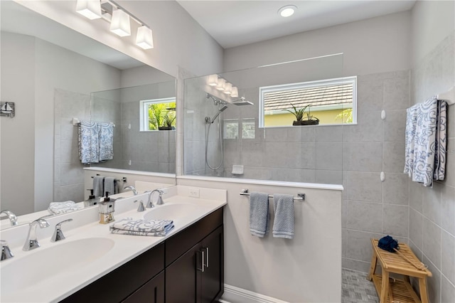 bathroom featuring walk in shower and double vanity