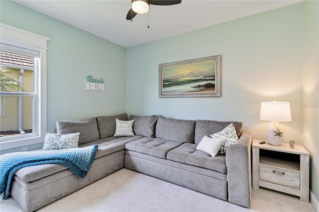 living room with carpet flooring and ceiling fan