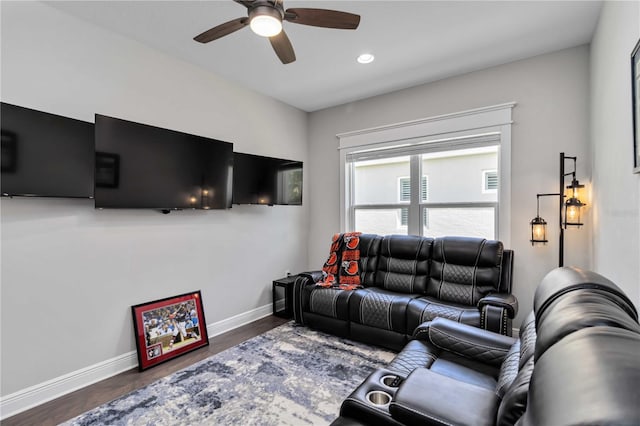 living area with a ceiling fan, baseboards, wood finished floors, and recessed lighting