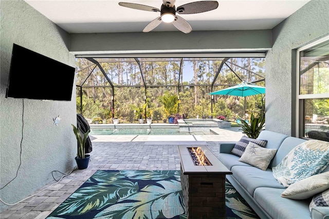 view of patio with an in-ground hot tub, an outdoor living space with a fire pit, an outdoor pool, and a lanai