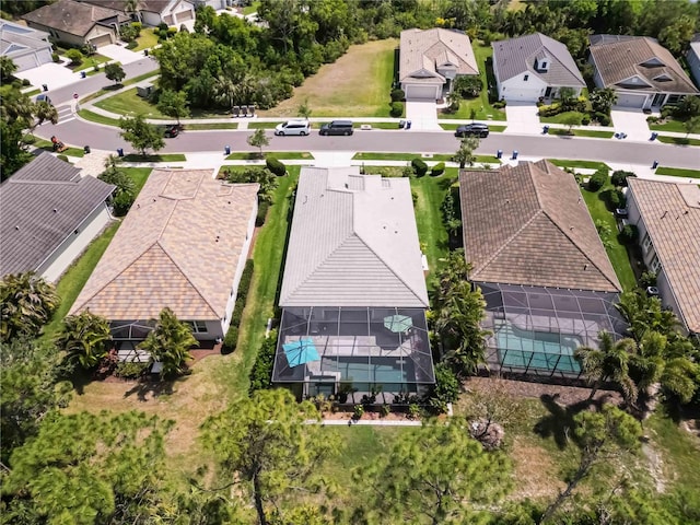 aerial view of residential area featuring a pool