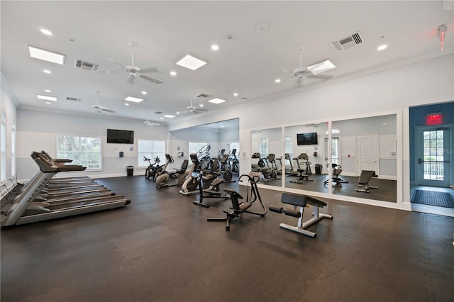 gym featuring ceiling fan, ornamental molding, plenty of natural light, baseboards, and recessed lighting
