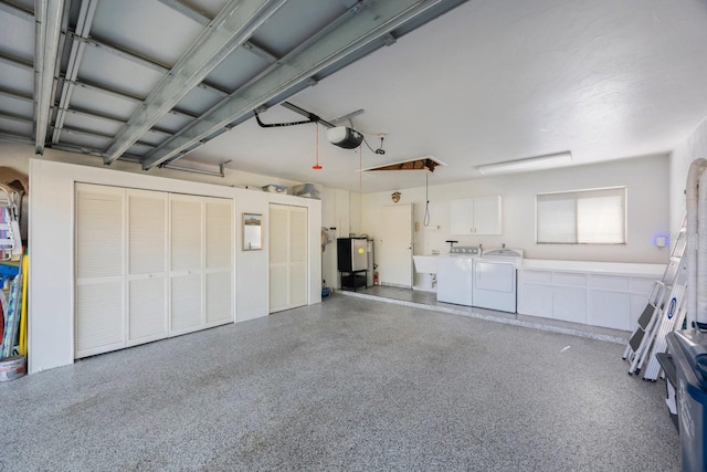 garage featuring a garage door opener and washer and clothes dryer