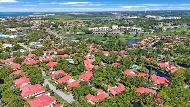 drone / aerial view with a water view and a residential view