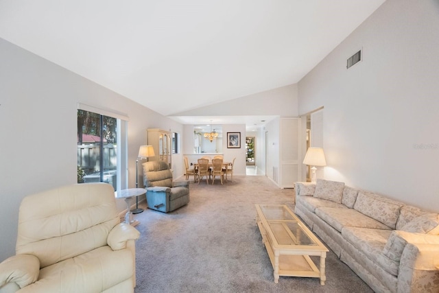 living area featuring vaulted ceiling, a notable chandelier, carpet, and visible vents