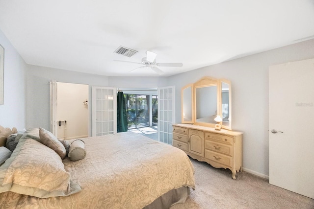bedroom with baseboards, light carpet, a ceiling fan, visible vents, and access to exterior