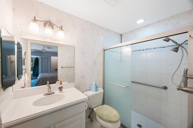 ensuite bathroom featuring vanity, ensuite bath, a ceiling fan, a stall shower, and wallpapered walls