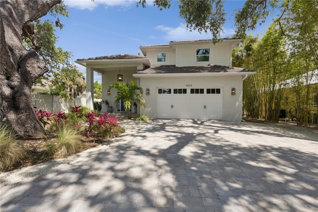 4013 Red Rock Ln, Sarasota, FL 34231 - view of front of property featuring a garage, driveway, and stucco siding