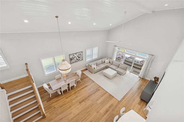 4013 Red Rock Ln, Sarasota, FL 34231 - living area with light wood-style floors, high vaulted ceiling, baseboards, recessed lighting, and beamed ceiling