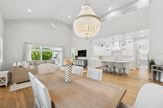 4013 Red Rock Ln, Sarasota, FL 34231 - dining room with high vaulted ceiling, a chandelier, light wood-style flooring, beam ceiling, and a ceiling fan