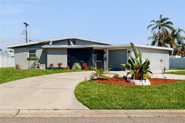 5727 25th St W, Bradenton, FL 34207 - mid-century home featuring driveway, fence, a garage, and stucco siding