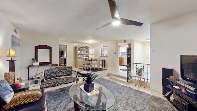 5727 25th St W, Bradenton, FL 34207 - living room featuring baseboards and a ceiling fan