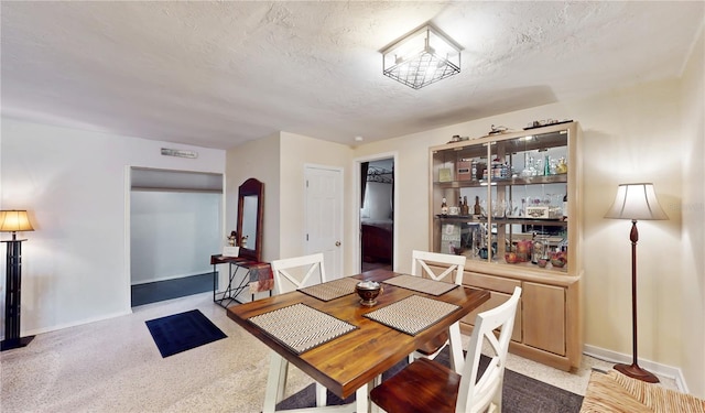 5727 25th St W, Bradenton, FL 34207 - dining space with a textured ceiling and baseboards
