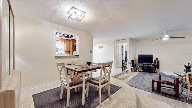 5727 25th St W, Bradenton, FL 34207 - dining room featuring visible vents, a textured ceiling, baseboards, and ceiling fan