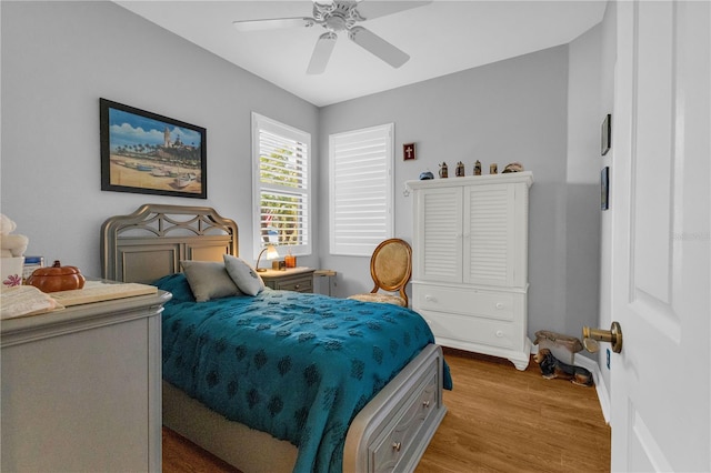2064 Batello Dr, Venice, FL 34292 - bedroom featuring light wood-style floors, baseboards, and a ceiling fan
