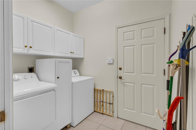 2064 Batello Dr, Venice, FL 34292 - laundry room with cabinet space, washing machine and dryer, and light tile patterned floors