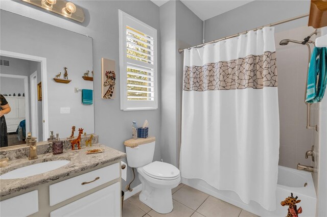 2064 Batello Dr, Venice, FL 34292 - bathroom with tile patterned flooring, vanity, toilet, and shower / bath combo with shower curtain