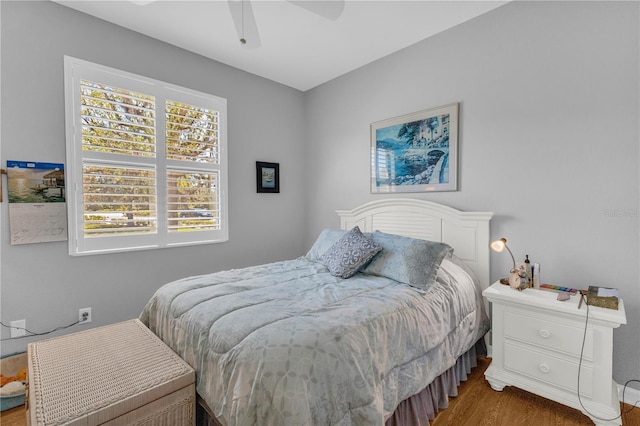 2064 Batello Dr, Venice, FL 34292 - bedroom featuring wood finished floors and a ceiling fan