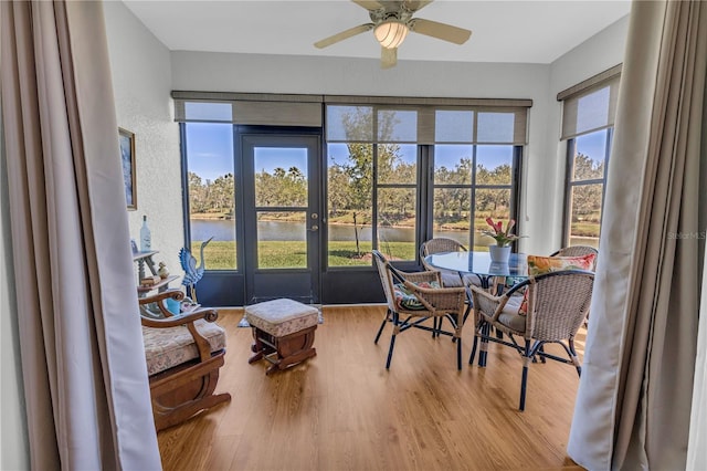 2064 Batello Dr, Venice, FL 34292 - sunroom / solarium with french doors, wood finished floors, and a water view
