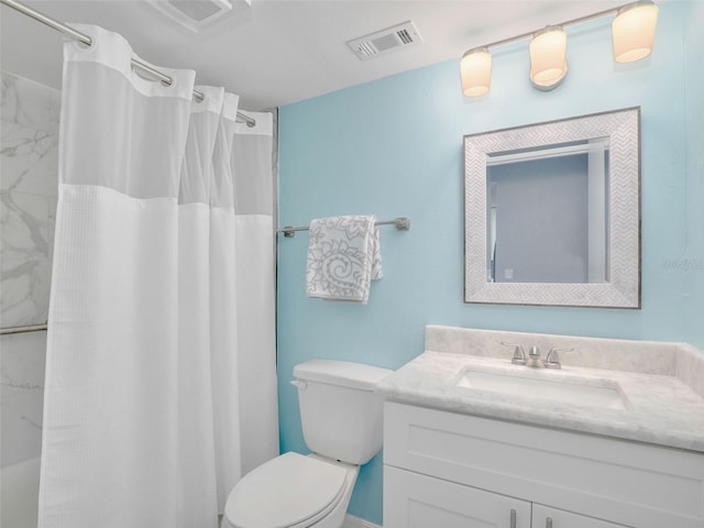 21687/689 Indian Bayou Dr, Fort Myers Beach, FL 33931 - bathroom with visible vents, toilet, and vanity