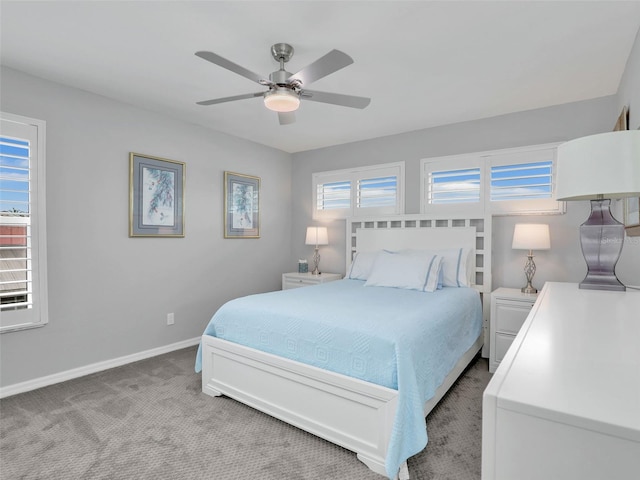 21687/689 Indian Bayou Dr, Fort Myers Beach, FL 33931 - bedroom featuring light carpet, baseboards, and a ceiling fan