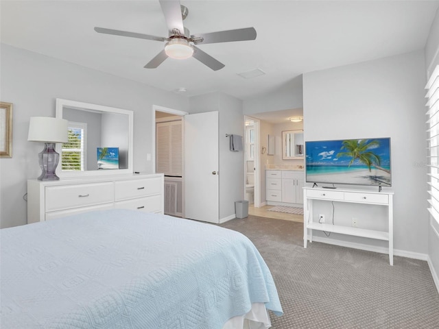 21687/689 Indian Bayou Dr, Fort Myers Beach, FL 33931 - bedroom featuring a ceiling fan, carpet, baseboards, and connected bathroom
