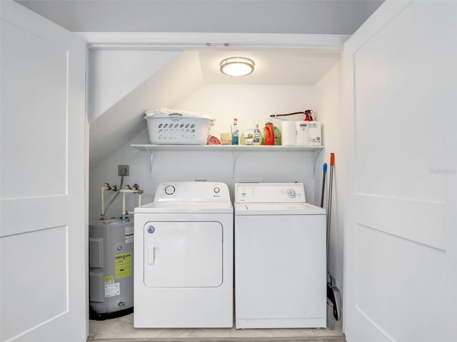 21687/689 Indian Bayou Dr, Fort Myers Beach, FL 33931 - washroom featuring water heater, washer and clothes dryer, and laundry area