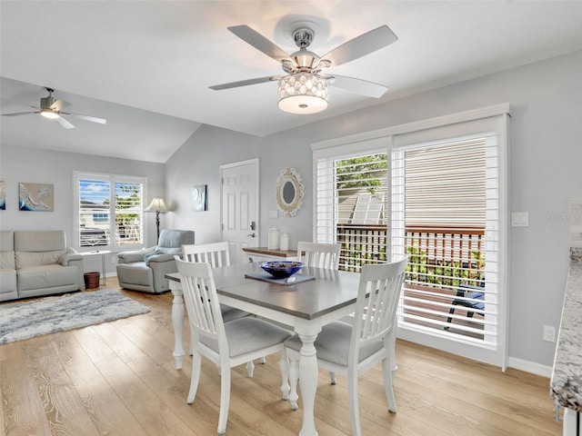 21687/689 Indian Bayou Dr, Fort Myers Beach, FL 33931 - dining space with baseboards, lofted ceiling, light wood-type flooring, and a ceiling fan